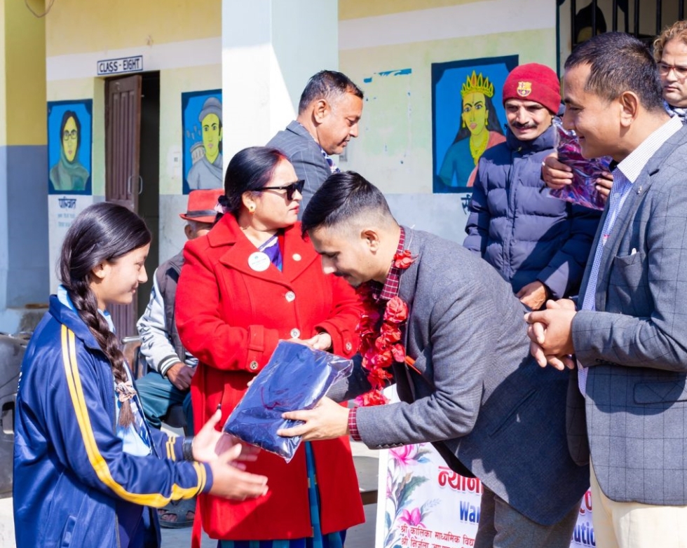 Distributing study materials to the students.